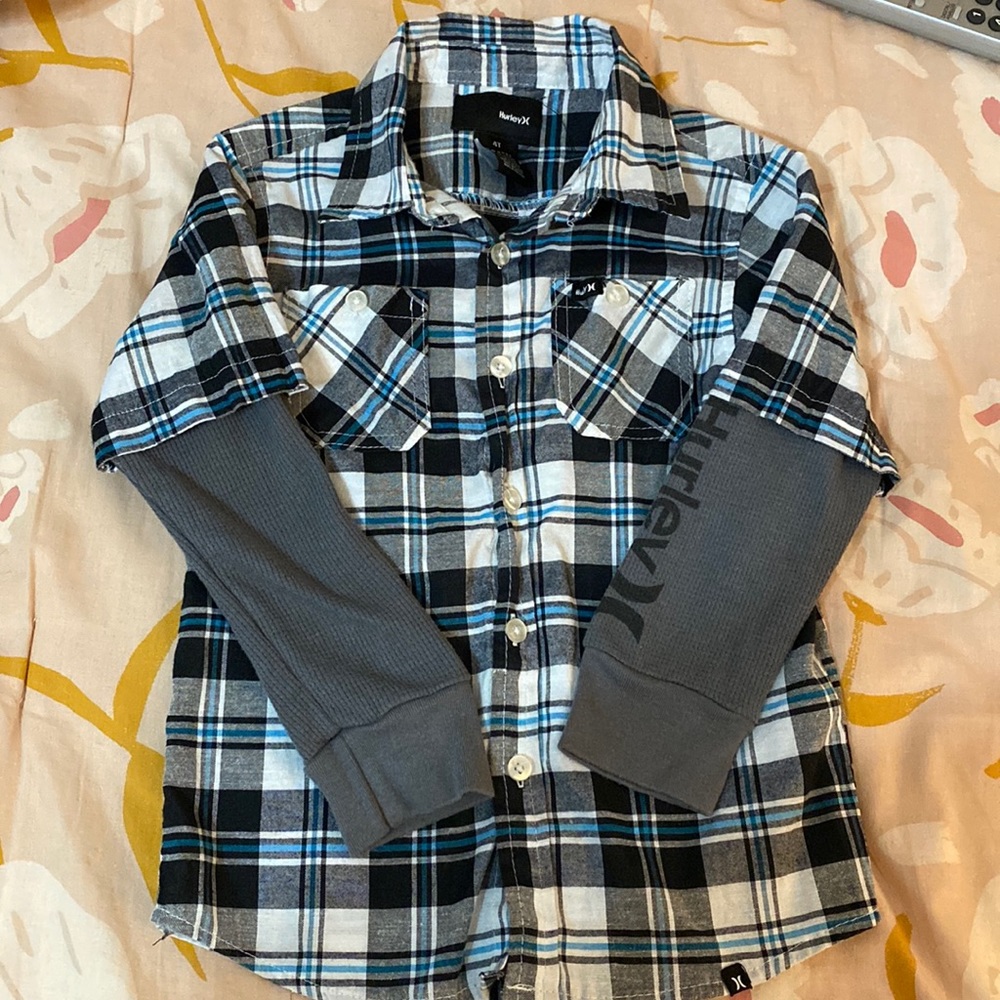 Hurley plaid shirt with connected sleeves.